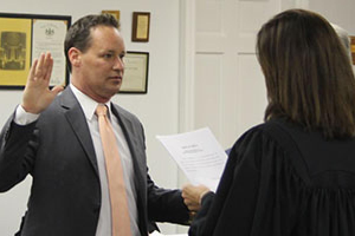 Joe Blackburn Jr being sworn in as Aldan Mayor by Hon. Kelly Micozzie-Aquirre